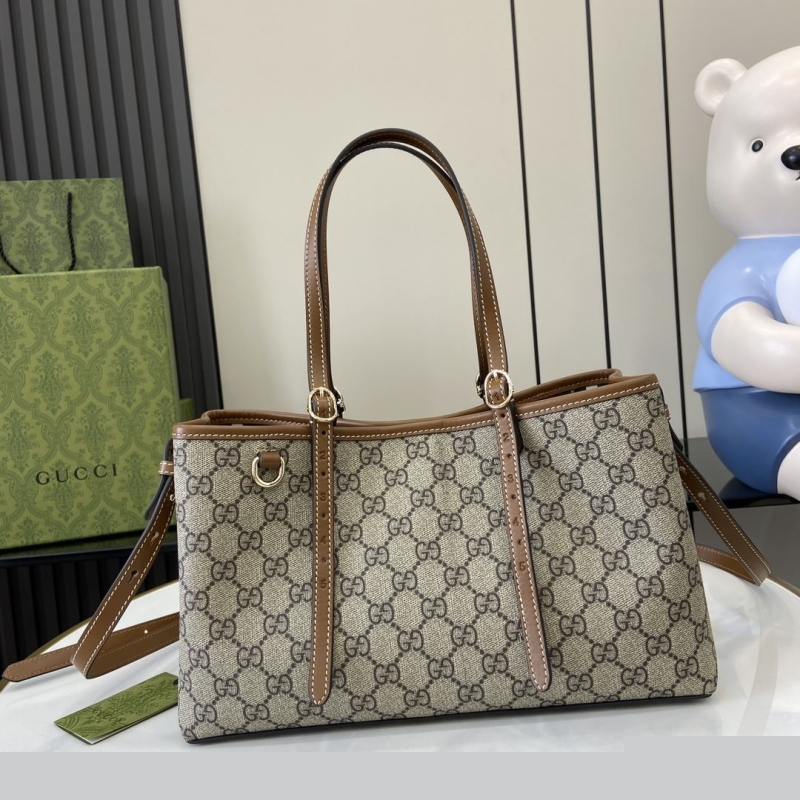 G*u*i shopping bags